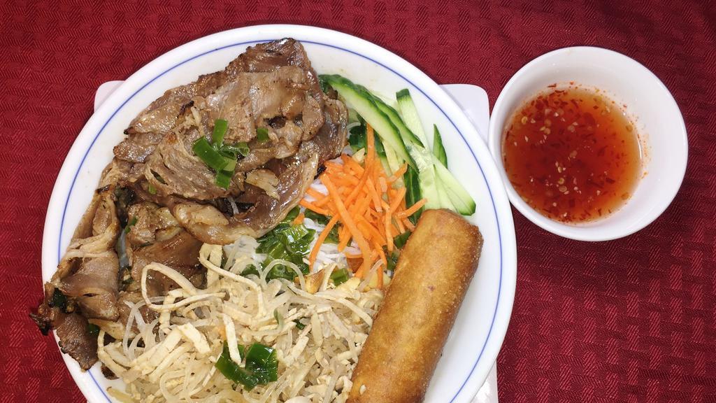 B7. Bun thit nuong,bi, cha gio · Vermicelli with grilled pork, shredded pork skin and egg roll.