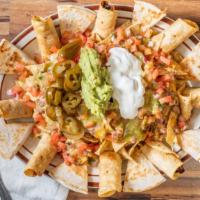 Fiesta Platter · Combination platter, sampling of nacho supreme, taquitos and quesadillas.