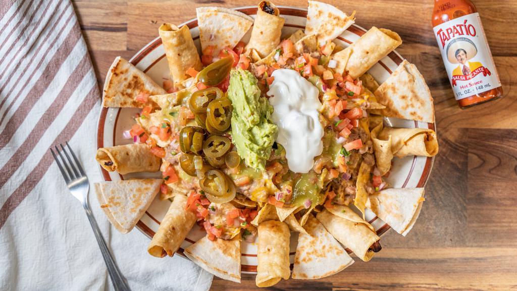 Fiesta Platter · Combination platter, sampling of nacho supreme, taquitos and quesadillas.