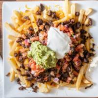 Steak Fries · Crispy fries with melted cheese topped with steak & toppings.