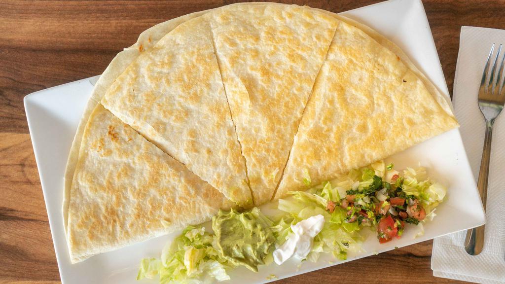 Quesadilla · Flour tortilla filled with melted cheese and your choice of meat.