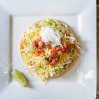 Super Taco · Your choice of meat lettuce pico de gallo guacamole cheese and sour cream on a large soft co...