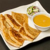 |A2| Roti & Kari (2 pcs) · Pan-fried layered flatbread served with a side of curry sauce & cucumber salad.