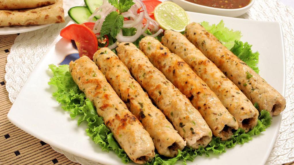 Chicken Seekh Kabab · Ground chicken marinated with delicious spices. Cooked in a Clay Oven. Served on Skewers.