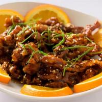 (C) Sesame Beef · Strips of beef lightly fried in a sweet and tangy sauce; topped with a sprinkle of sesame se...