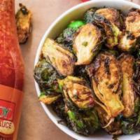 Sweet Chili Brussels Sprouts · Fried Brussels Sprouts, lightly seasoned and tossed in a sweet chili glaze.
