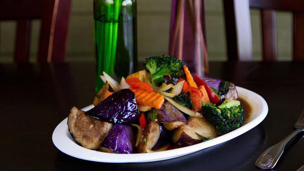 Eggplant · Mild spiciness. Stir fried with bell peppers, carrots, onions, and basil.