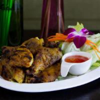 B-B-Q Chicken · Marinated with thai herbs served with sweet and sour sauce.