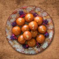 Gulab Jamun · Soft delicious berry sized balls made of milk solids, flour & sugary syrup.