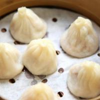 Shanghai Soup Dumplings (6) (小籠包） · Also known as xiao long bao, filled with pork and delicious gelatin-gelled aspic soup.