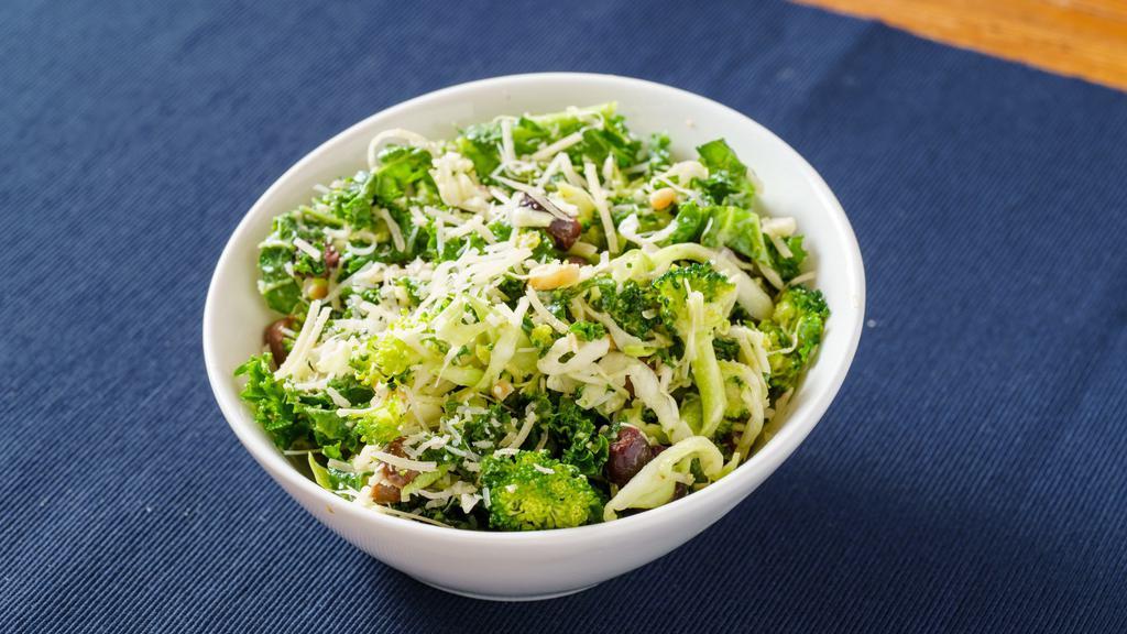 Broccoli & Kale Slaw with Almonds · Gf. Slaw of broccoli, kale, and cabbage with kalamata olives, almonds, and grated Parmesan, tossed with an anchovy, lemon juice, and mustard dressing.