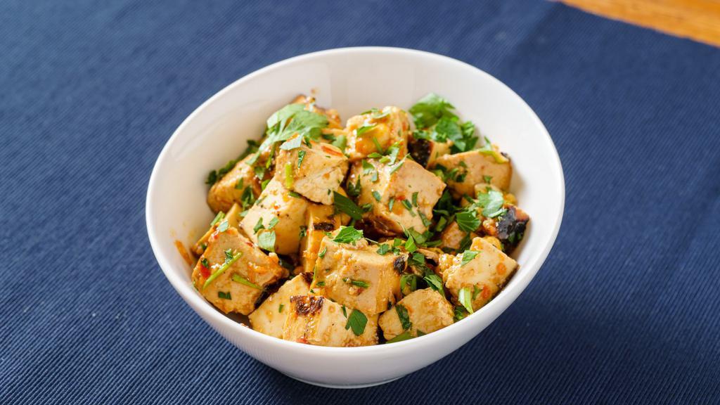 Spicy Thai Tofu with Peanuts · Vegan, gluten- free. Marinated tofu tossed with cilantro, mint, pickled ginger, green onions, peanuts and a spicy chili lime dressing.