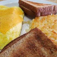 Breakfast Omellete · 2 eggs scrambled with your choice of cheese. Served with your choice of bread.