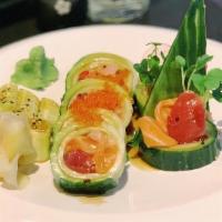 32. Summer Roll · Cucumber wrap with tuna, hamachi, salmon, tobiko and sauce.