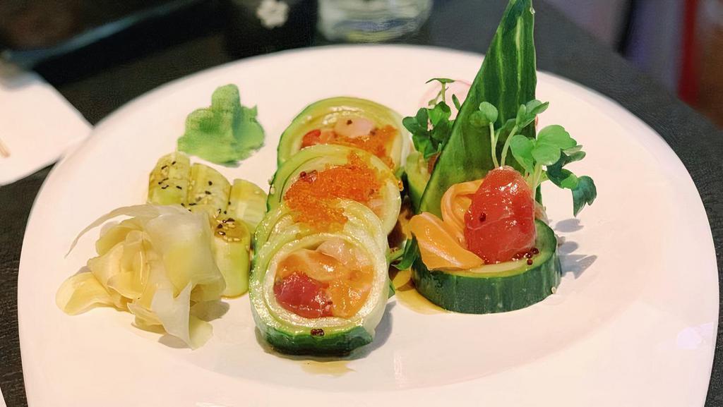 32. Summer Roll · Cucumber wrap with tuna, hamachi, salmon, tobiko and sauce.
