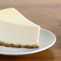 The Cheesecake · A  rich  and  creamy New York-style cheesecake baked inside a honey-graham crust.