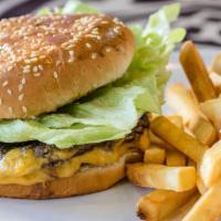 Oasis Cheeseburger · 6 oz. 1/3 pound fresh ground beef, lettuce, tomatoes, pickles, Oasis sauce in bun served wit...