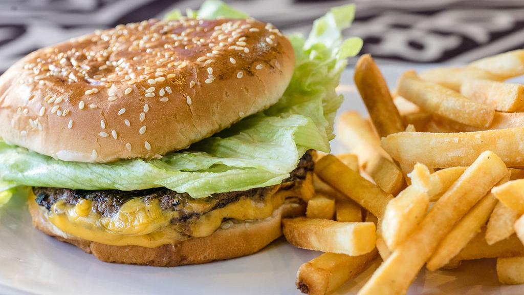 Oasis Cheeseburger · 6 oz. 1/3 pound fresh ground beef, lettuce, tomatoes, pickles, Oasis sauce in bun served with French fries.