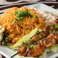 Chicken Kabob Plate · Grilled seasoned chicken breast cubes served with salad and rice.