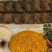 Kefta Kabob Plate · Grilled seasoned ground lamb and beef served with salad , hummus  and rice.