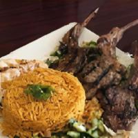 lamb chop plate · 4 lamb chops on a bed of rice, with a side of humus , Jerusalem salad and pita .