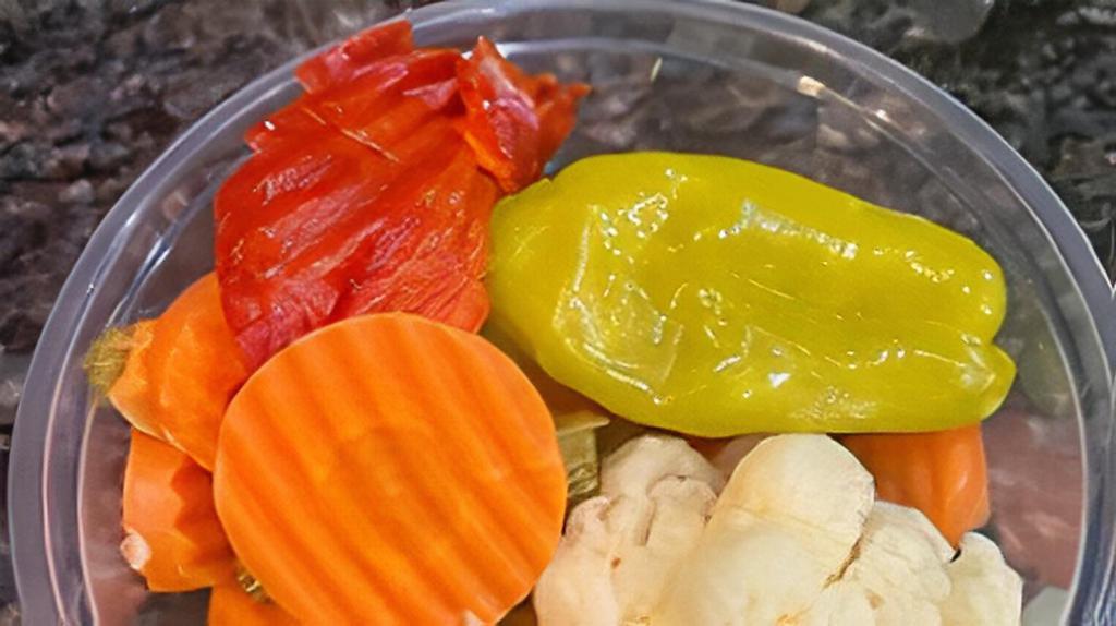 Mixed Pickles  · Pickled Cauliflower carrots and Jalapeño will bell Pepper.