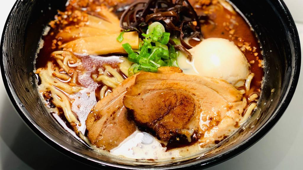 Kuro Tonkotsu Ramen · Traditional Tonkotsu (pork) Broth with black garlic, chashu pork, green onion, soft-boiled egg*, fried garlic, and kikurage mushrooms