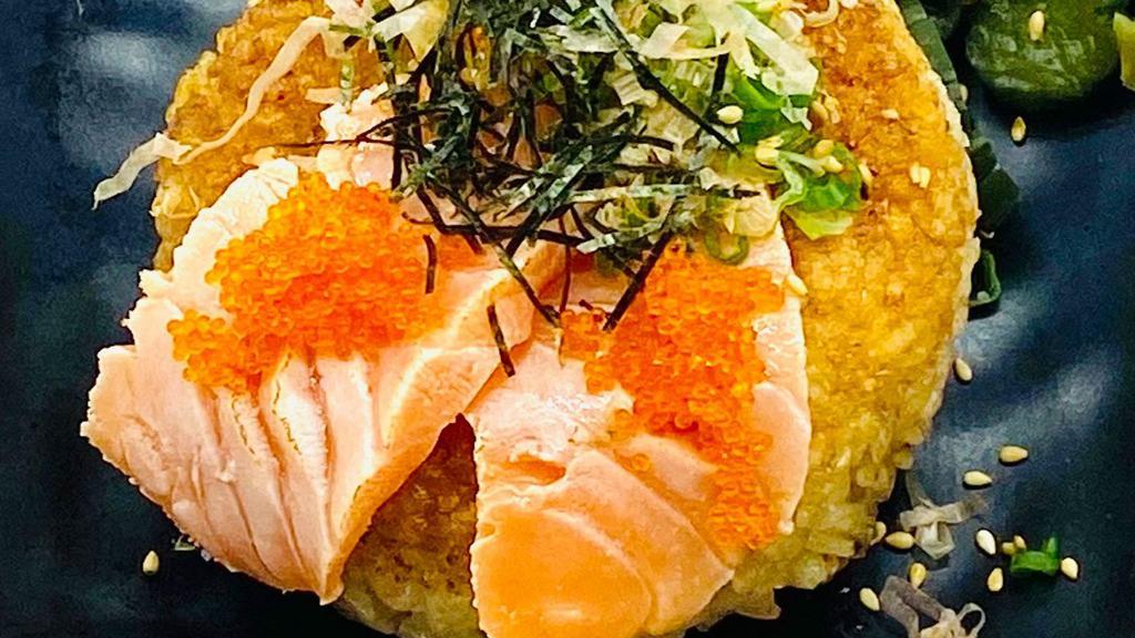 Yaki Onigiri Salmon & Tobiko · Grilled crispy rice ball with salmon sashimi and tobiko (flying fish roe) topping
