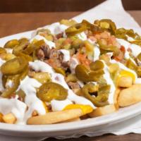 Steak Fries · French fries smothered in nacho cheese, beef, sour cream pico de gallo & guacamole.