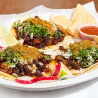 Tacos · Includes meat, onions, cilantro & salsa.