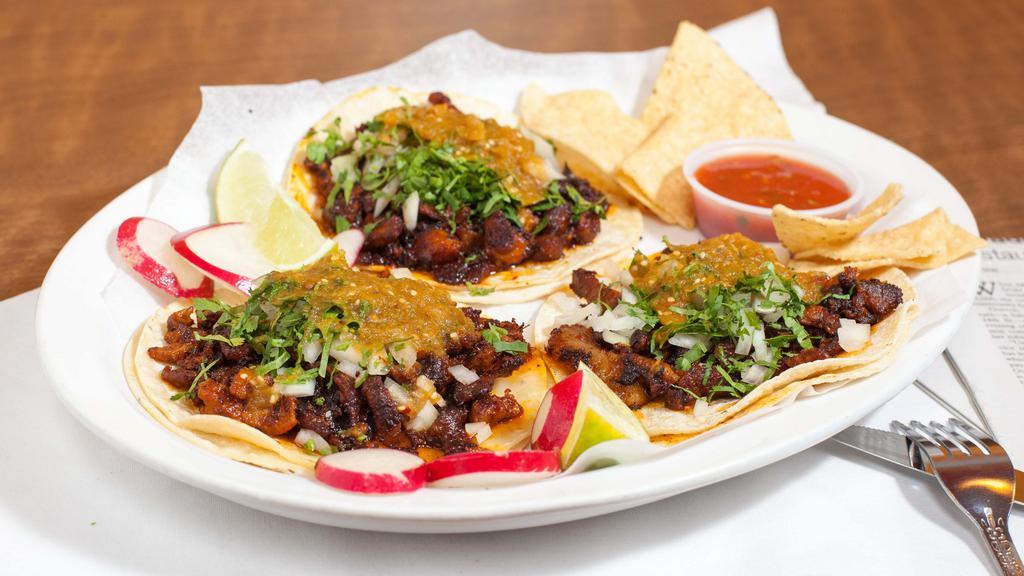 Tacos · Includes meat, onions, cilantro & salsa.