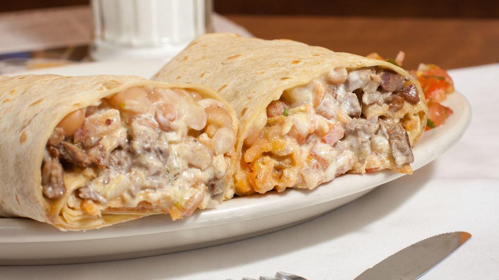 Super Burrito · Your choice of meat, rice, beans, pico de gallo, cheese, sour cream & guacamole.