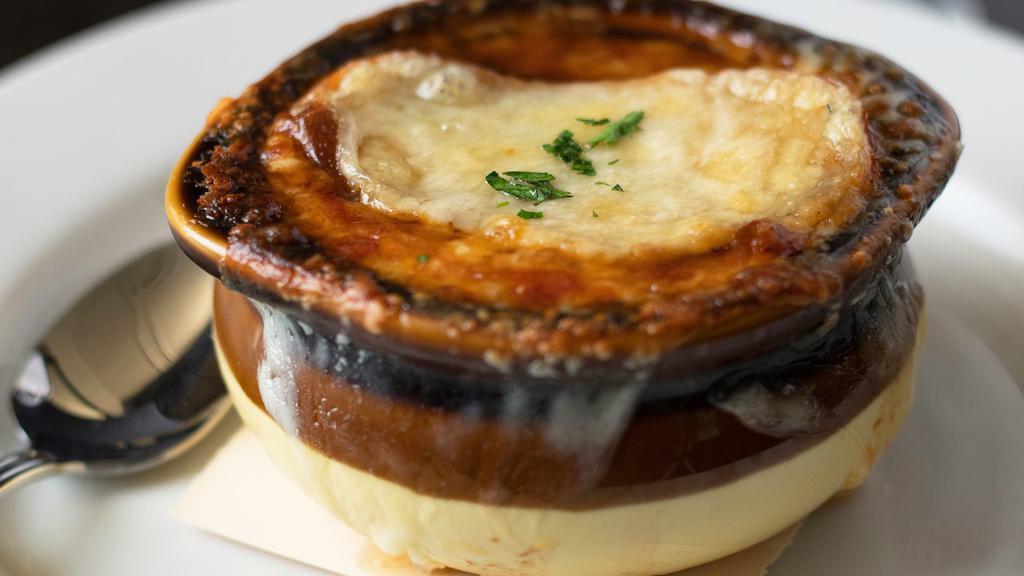 French Onion Soup · 48-hour beef stock, three cheese gratin, sourdough crostini.