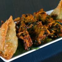 Assorted Appetizer · Includes two pieces of vegetable samosa and vegetable pakoras.
