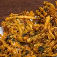 Vegetable Pakora · Fried mixed vegetable fritters coated with garbanzo beans batter.