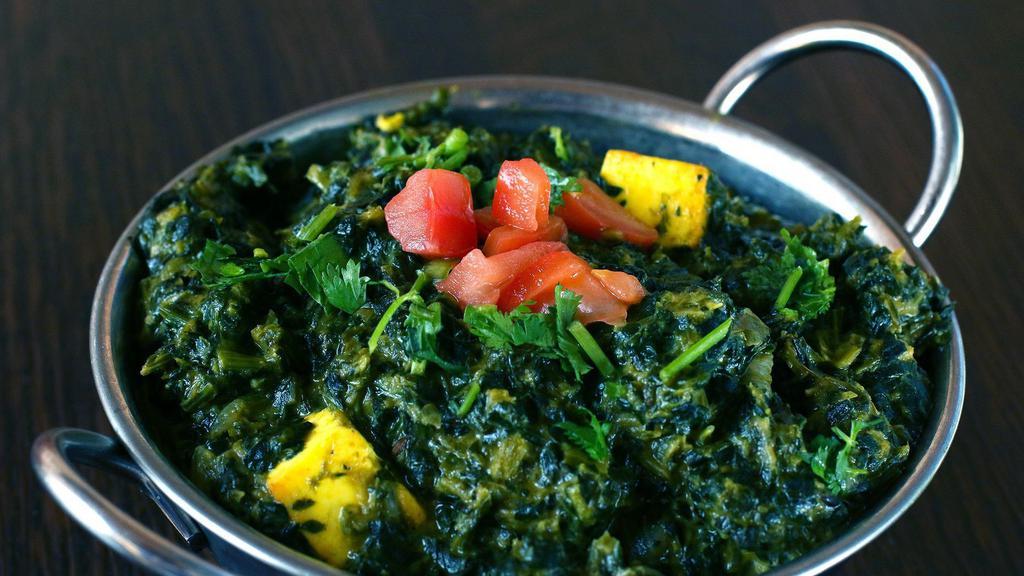 Sag Paneer · Vegetarian. Fresh spinach cooked with homemade farmer's cheese, nutmeg, spices, ginger and cilantro.