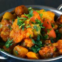 Aloo Gobi · Vegetarian. Fresh cauliflower and young potatoes cooked with onions, turmeric and fresh herbs.