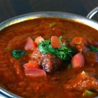 Lamb Vindaloo · Lamb cooked with young potatoes and herbs in a spicy sauce.
