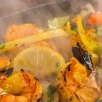 Prawn Masala · Prawns sauteed with onions, ginger, fresh tomatoes, herbs, spices and saffron.
