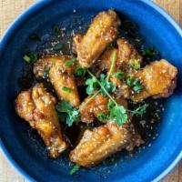 Sweet Thai Chilli (6 Pieces) · Spicy. Sweet and savory Thai chicken wings. Tossed in house made sticky fish sauce and tosse...