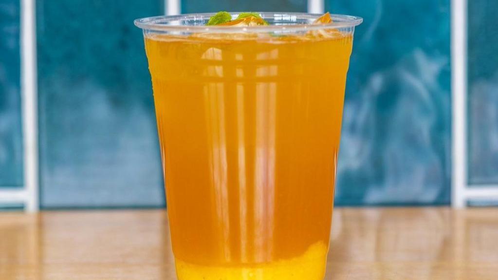 Mango Jasmine Iced Tea · Iced mango jasmine tea with real mango puree.