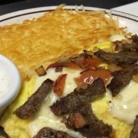 Greek Omelette · Filled with gyro, sautéed and tomatoes topped with feta cheese. Includes toast or pancake an...
