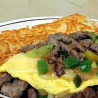 Steak Omelette · Marinated tri-tip, sautéed with onions and bell peppers, topped with your choice of cheese.