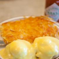 Eggs Benedict · Poached eggs and Canadian bacon or turkey or florentine (tomato and spinach) on English muff...