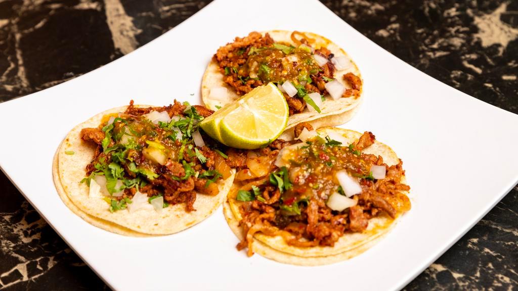 Regular Taco · Choice of meat, cilantro, onions and salsa.