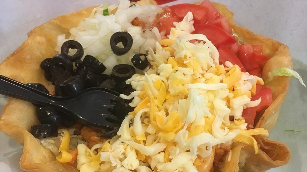 Taco Salad · Choice of meat, lettuce, rice, beans, cheese, guacamole, sour cream, salsa and tomato.