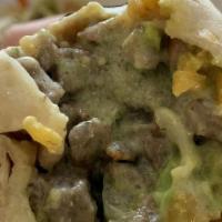 Super Burrito · Choice of meat, rice, beans, guacamole, cheese, sour cream and salsa. Add meat for an additi...