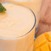 Mango Lassi · Smooth, creamy Indian style mango smoothie with a dash of cinnamon.