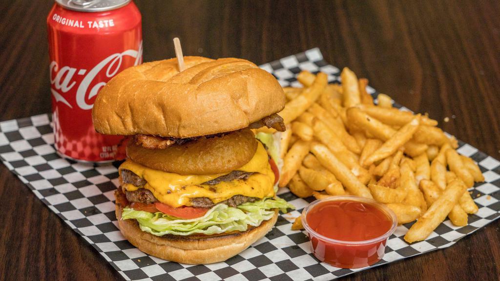 4. 1/2 lb. Western BBQ Bacon Burger · Includes BBQ Sauce, fried onion ring, bacon, American cheese, lettuce & tomato.