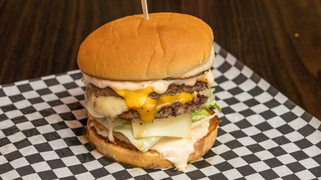 6. Four Cheese 1/2 lb. Double Burger · Served with special sauce, lettuce, tomato, and American, Swiss, cheddar, and jack cheeses.